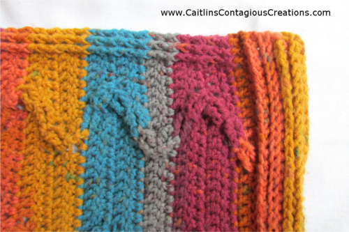 Zig Zag Autumn Poncho Crochet Pattern by Caitlin's Contagious Creations. Lovely cabled design with thick chunky zig zags and a built in border. This easy, beginner friendly crochet pattern is available free, check it out today!