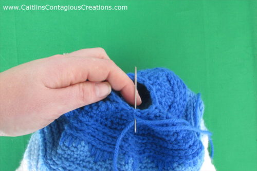 Cascading Icicles Beanie Crochet Pattern a free design from Caitlin's Contagious Creations. This fun and easy winter hat crochet pattern has an option for a messy bun ponytail hat too!! The pattern features written directions and step by step photo instructions. Get started on yours now!