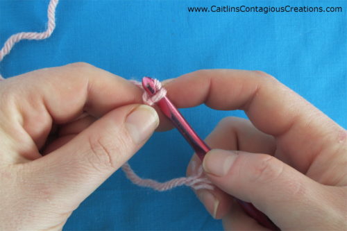 use crochet hook to pull yarn over loop down through loop on hook