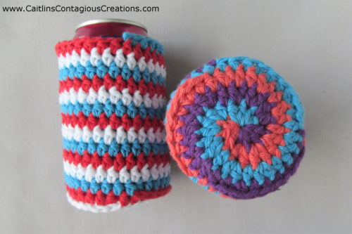 2 can cozies laying down, spiral bottom showing on grey background