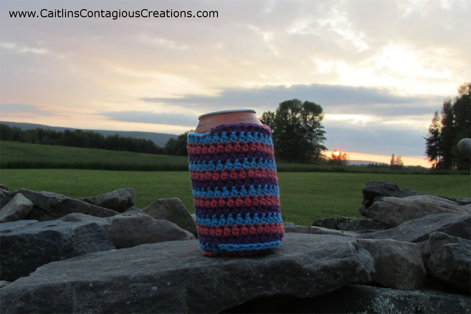 finished can cozy on rock wall with sunset in the background