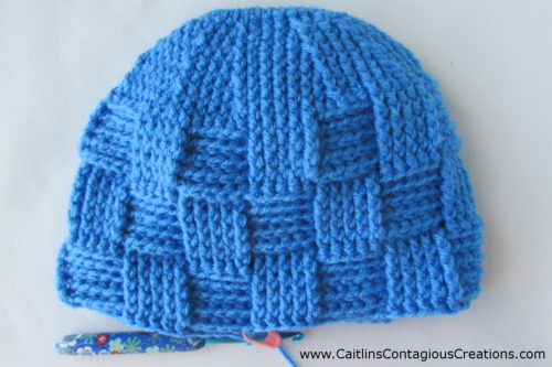 after row 24 of directions for basket weave hat.