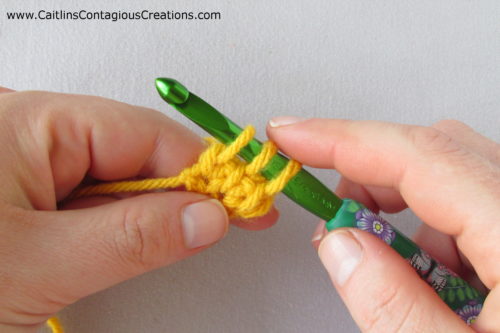 3 loops on hook in mustard colored yarn