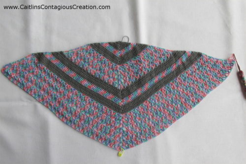 triangle shawl after row 31 is complete. Two complete repeats of the pattern.