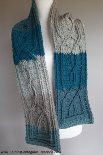 finished knotted cable scarf on mannequin.